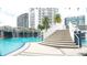 Resort-style pool with stairs leading to a waterfall feature at 1209 E Cumberland Ave # 1003, Tampa, FL 33602