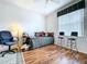 Spare bedroom with a daybed, hardwood floors, window with blinds, and office chair at 1218 Willow Bend Way, Lutz, FL 33549