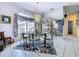 Elegant dining room featuring chandelier, mirrored wall, and view of entry at 1218 Willow Bend Way, Lutz, FL 33549