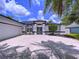 Charming home featuring a well-manicured lawn, a spacious driveway, and a two-car garage at 1218 Willow Bend Way, Lutz, FL 33549