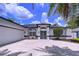 Inviting home with double door entrance, a well-maintained lawn, and a spacious driveway leading to a two-car garage at 1218 Willow Bend Way, Lutz, FL 33549