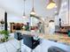 Kitchen island with barstool seating and views into the living areas of the home at 1218 Willow Bend Way, Lutz, FL 33549