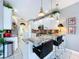 Bright kitchen with white cabinets, breakfast bar, and stainless steel appliances at 1218 Willow Bend Way, Lutz, FL 33549