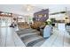Bright living room with tile floors, furniture, and view of the dining room and kitchen at 1218 Willow Bend Way, Lutz, FL 33549