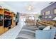 Open concept living room with tile floors and view of dining room and entryway at 1218 Willow Bend Way, Lutz, FL 33549