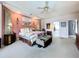 Spacious primary bedroom features carpet floors, neutral paint, and large windows for natural light at 1218 Willow Bend Way, Lutz, FL 33549