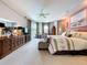 Spacious primary bedroom features carpet floors, neutral paint, and sliding glass doors to lanai at 1218 Willow Bend Way, Lutz, FL 33549