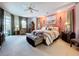 Spacious primary bedroom features carpet floors, neutral paint, and sliding glass doors to lanai at 1218 Willow Bend Way, Lutz, FL 33549