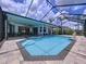 Inviting screened-in pool area with a sparkling pool, comfortable seating, and well-maintained tile flooring at 1218 Willow Bend Way, Lutz, FL 33549