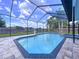 Beautiful screened-in pool area featuring a clear pool, a spa, and a well-kept patio with ample space at 1218 Willow Bend Way, Lutz, FL 33549