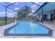 Inviting screened pool and spa area with patio and beautiful views of a manicured backyard at 1218 Willow Bend Way, Lutz, FL 33549