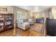 Comfortable living room with a gray sofa, wood floors and a vintage hutch at 1226 E Henry Ave, Tampa, FL 33604