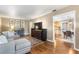 Cozy living area featuring hardwood floors, stylish decor, and seamless transition to other spaces at 1226 E Henry Ave, Tampa, FL 33604