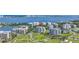 Aerial view of the condo complex with water views and golf course at 125 Belleview Boulevard # 203, Belleair, FL 33756