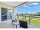 Relax on this comfortable balcony with great views of the lawn and trees at 125 Belleview Boulevard # 203, Belleair, FL 33756