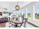 Inviting dining area with hardwood floors and a chandelier, offering plenty of natural light and elegant design at 125 Belleview Boulevard # 203, Belleair, FL 33756