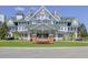 Beautifully landscaped front entrance of a grand Bellevue Inn building, showcasing architectural charm and curb appeal at 125 Belleview Boulevard # 203, Belleair, FL 33756