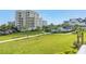 Lush lawn, mature landscaping and walking paths offer beautiful views from this property at 125 Belleview Boulevard # 203, Belleair, FL 33756
