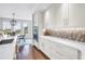 Open kitchen with white cabinetry, stainless appliances, and a view of the dining area and outside at 125 Belleview Boulevard # 203, Belleair, FL 33756