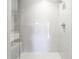 Shower with clear glass partition and tiled walls with shower niche at 125 Belleview Boulevard # 203, Belleair, FL 33756