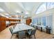 Spacious arts and crafts room with large table, ample storage cabinets, and bright natural light at 1338 Winding Willow Dr, Trinity, FL 34655