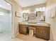 Bathroom featuring a double sink vanity, granite countertops, and plenty of storage space at 1338 Winding Willow Dr, Trinity, FL 34655