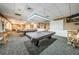 Well-lit billiard room featuring two pool tables, comfortable seating, and a relaxing atmosphere at 1338 Winding Willow Dr, Trinity, FL 34655