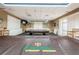 Spacious billiard room featuring a pool table with Heritage Springs logo and comfortable seating at 1338 Winding Willow Dr, Trinity, FL 34655