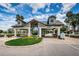 Attractive gated community entrance with manicured landscaping and a visitor clearance station at 1338 Winding Willow Dr, Trinity, FL 34655