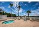 Community spa with lounge chairs and landscaping, with a view of the lake at 1338 Winding Willow Dr, Trinity, FL 34655