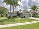 Beautiful single-story home with lush landscaping and a spacious driveway at 1338 Winding Willow Dr, Trinity, FL 34655
