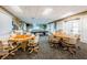 Game room features billiard table and tables for card games and comfortable seating at 1338 Winding Willow Dr, Trinity, FL 34655