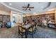 Cozy library filled with bookshelves, a table for reading, and comfortable seating areas at 1338 Winding Willow Dr, Trinity, FL 34655