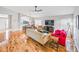 Bright living room boasts hardwood floors and an open floor plan perfect for entertaining at 1338 Winding Willow Dr, Trinity, FL 34655