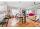 Open concept living and dining area with hardwood floors and modern furnishings at 1338 Winding Willow Dr, Trinity, FL 34655