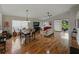 Open living area with hardwood floors and sliding doors to the outdoor patio at 1338 Winding Willow Dr, Trinity, FL 34655