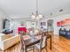 Spacious living room features a hardwood floor, with comfortable seating arrangements, and neutral decor at 1338 Winding Willow Dr, Trinity, FL 34655