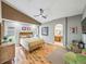 A well-lit primary bedroom boasts hardwood floors and a luxurious ensuite bathroom at 1338 Winding Willow Dr, Trinity, FL 34655