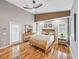 Primary bedroom featuring hardwood floors, natural light, and modern furnishings at 1338 Winding Willow Dr, Trinity, FL 34655
