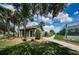 Charming pool house with manicured landscaping and easy access to nearby tennis courts at 1338 Winding Willow Dr, Trinity, FL 34655