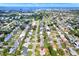 Scenic aerial view showcasing a neighborhood close to the waterfront and featuring tree-lined streets at 13795 Antigua Dr, Seminole, FL 33776