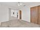Bedroom with carpet, sliding glass doors, and access to another room at 13795 Antigua Dr, Seminole, FL 33776