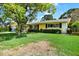 Beautiful single-Gathering home featuring lush landscaping and a well-manicured lawn at 13795 Antigua Dr, Seminole, FL 33776