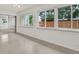 Bright sunroom with large windows overlooking the backyard at 13795 Antigua Dr, Seminole, FL 33776