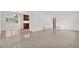 Open living space with tile flooring, white walls, and views into the dining and kitchen areas at 13795 Antigua Dr, Seminole, FL 33776