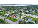 Expansive aerial view showcasing the community's tranquil pond and well-maintained landscaping at 1414 75Th Nw St, Bradenton, FL 34209
