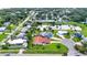 Aerial view of the neighborhood, pond, and a red roof home at 1414 75Th Nw St, Bradenton, FL 34209