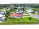 Aerial view of the home featuring a red tile roof and lake views at 1414 75Th Nw St, Bradenton, FL 34209