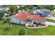 Aerial showcasing the home's front entrance, landscaping, and charming exterior details at 1414 75Th Nw St, Bradenton, FL 34209