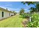 Spacious backyard with a well-maintained lawn and mature landscaping at 1414 75Th Nw St, Bradenton, FL 34209